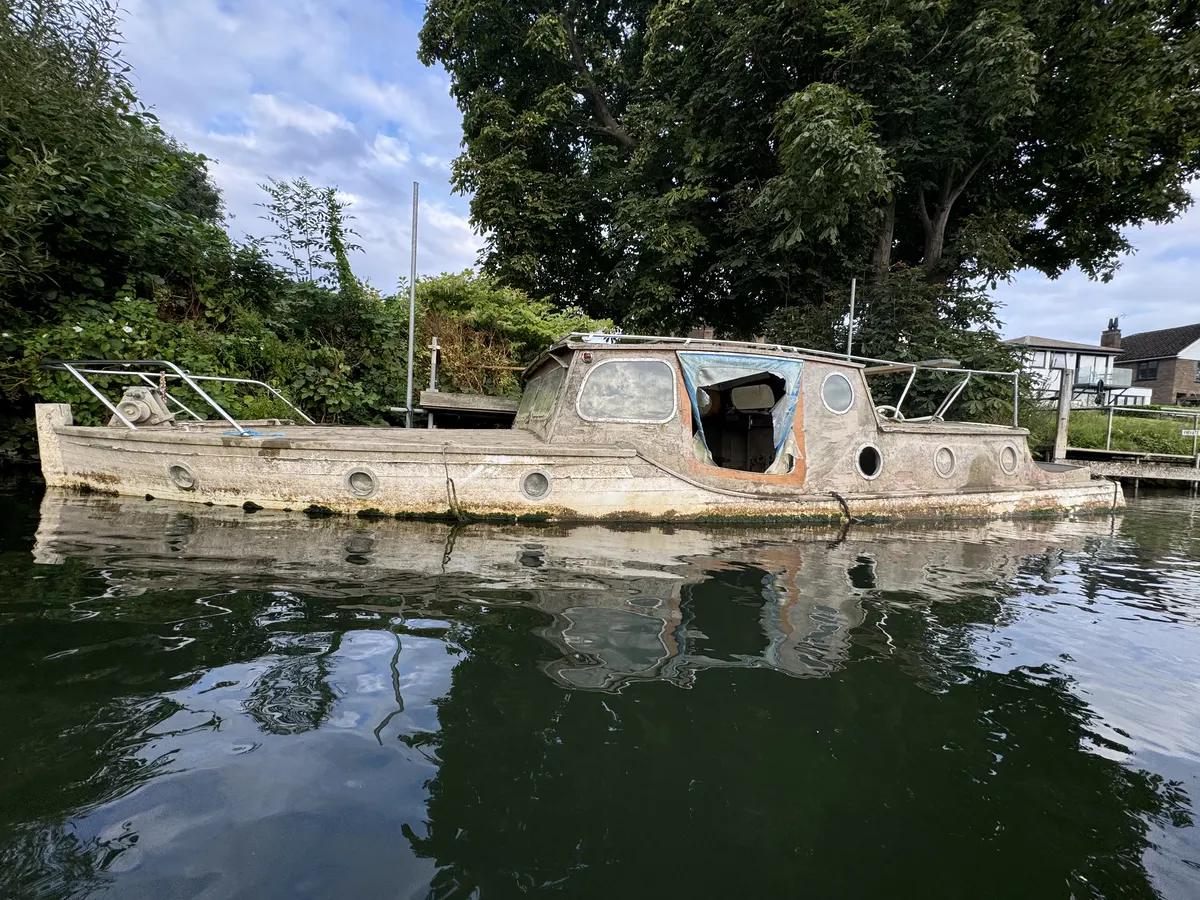 Sunken wooden boat in the Thames