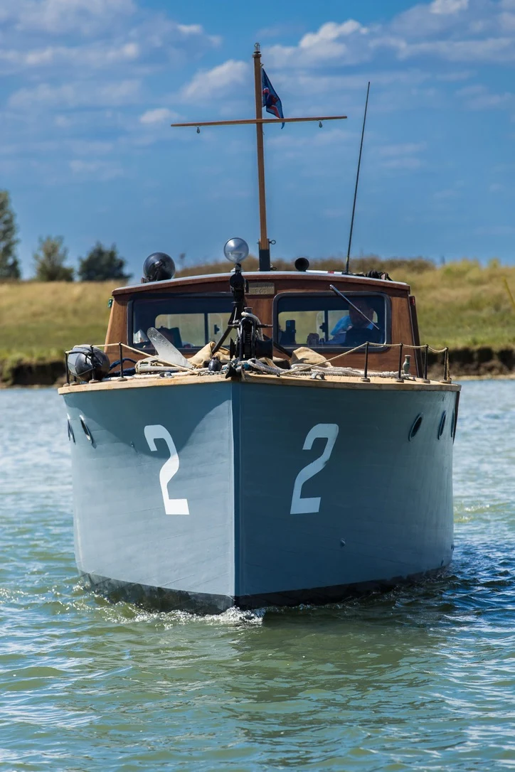 Gerfalcon's bow approaching in calm water